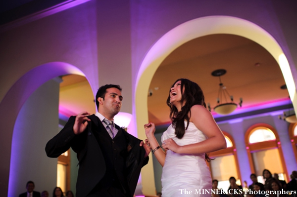 Indian bride and groom dance at their fusion indian wedding reception.