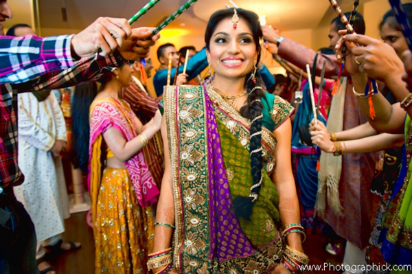 Indian bride in bridal sari enters garba.