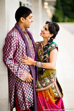 Indian bride and groom at their traditional wedding garba.