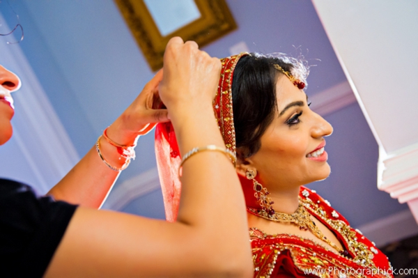 Indian bride gets Indian bridal hair and makeup done.