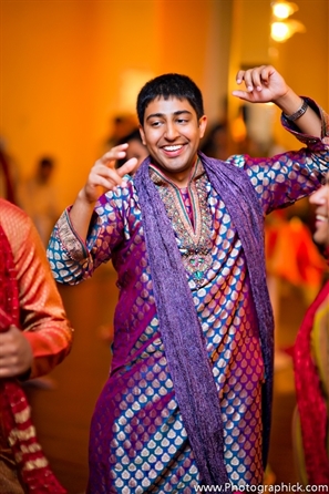 Indian wedding garba shows Indian groom in traditional garba kurta.