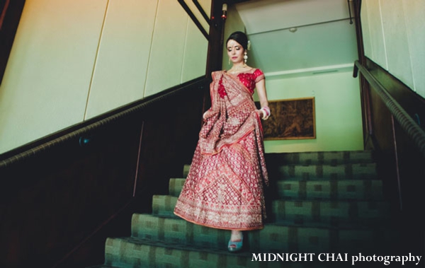 Indian bride wears red wedding lengha to indian wedding.