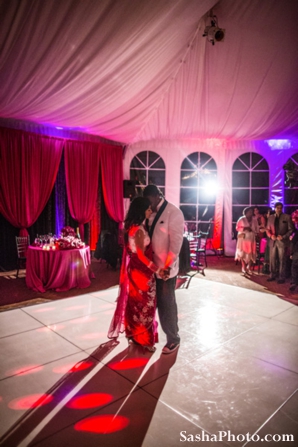 Indian bride and groom dance at fusion indian wedding reception.