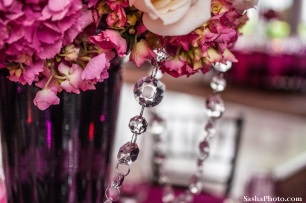 Indian wedding flower centerpiece in pink with crystals.