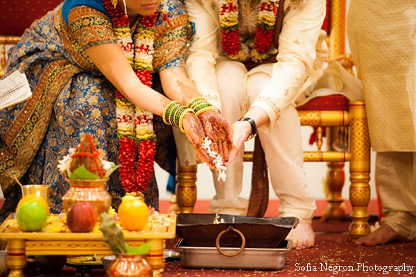 Indian wedding photography captures indian bride and groom at ceremony.