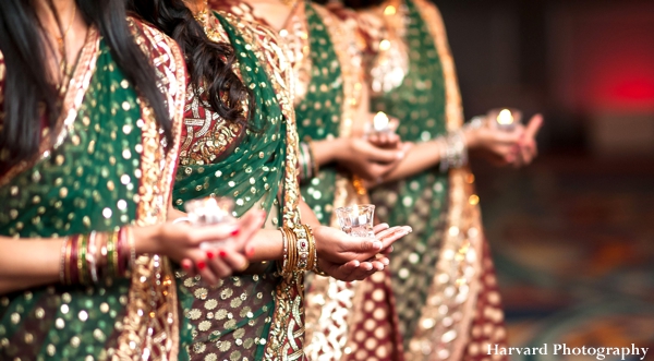 Indian wedding saris for bridesmaids in green and gold.