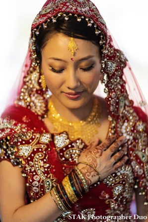 Fusion indian bride with bridal hair and makeup ideas.