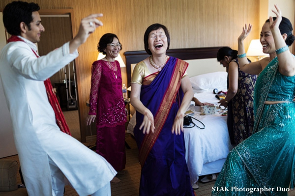 Indian wedding begins with family in wedding saris.