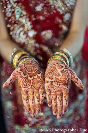 Indian bride wears bridal mehndi designs on her palms