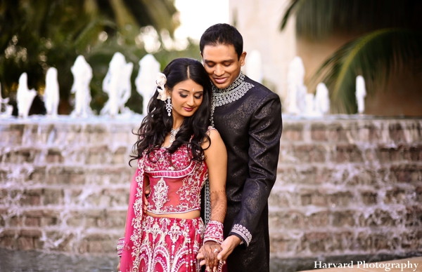 Indian bride wears hot pink wedding lengha.