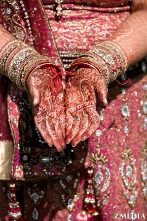 Indian bridal mehndi or henna on Indian bride's hands